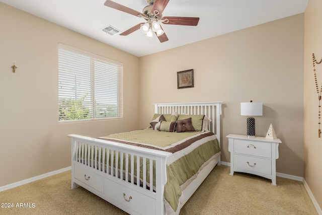 bedroom featuring ceiling fan and light colored carpet