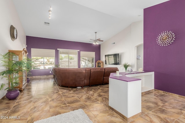 living room featuring high vaulted ceiling and ceiling fan