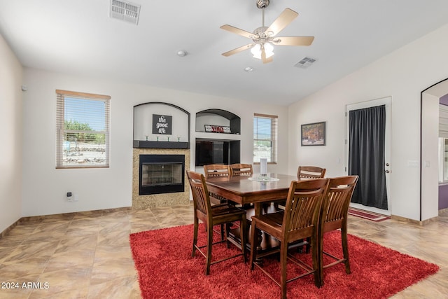 dining area featuring ceiling fan and vaulted ceiling