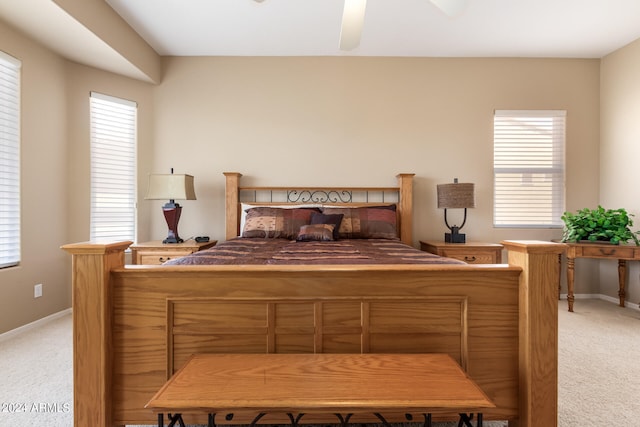 bedroom featuring ceiling fan and light colored carpet