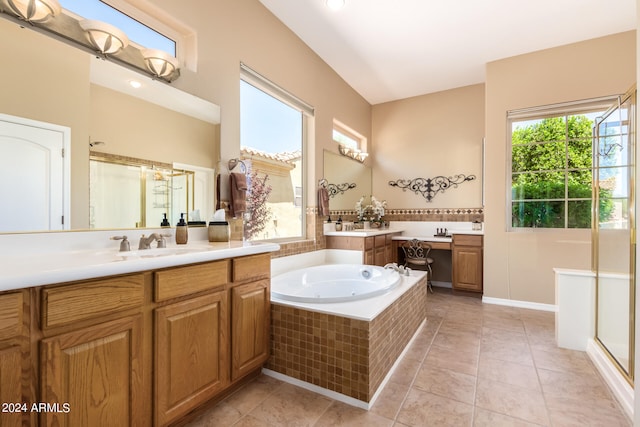 bathroom with tile patterned floors, vanity, and separate shower and tub