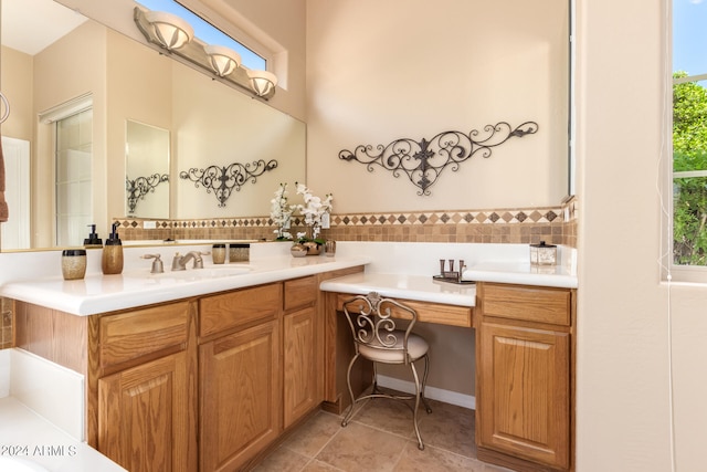 bathroom with vanity, plenty of natural light, and tile patterned floors