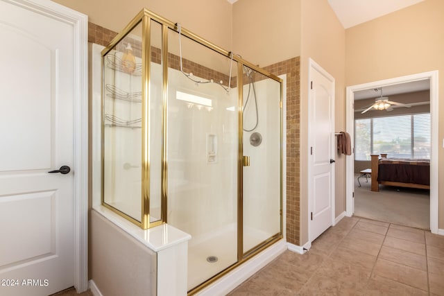 bathroom with ceiling fan, walk in shower, and tile patterned floors