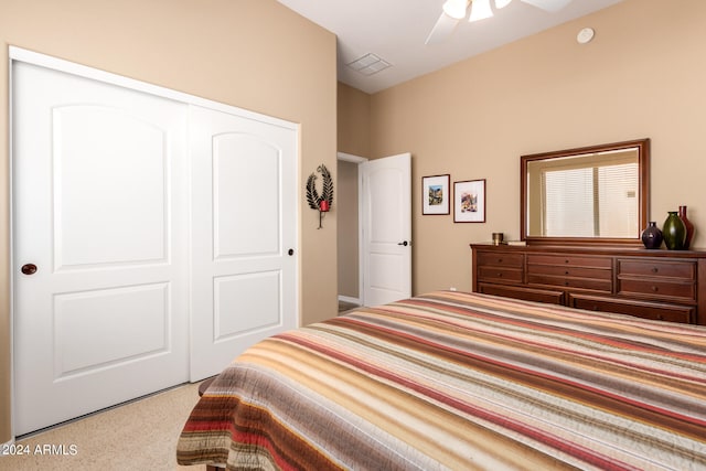 bedroom with light carpet, a closet, and ceiling fan