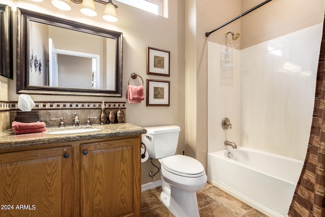 full bathroom featuring shower / tub combo with curtain, vanity, and toilet