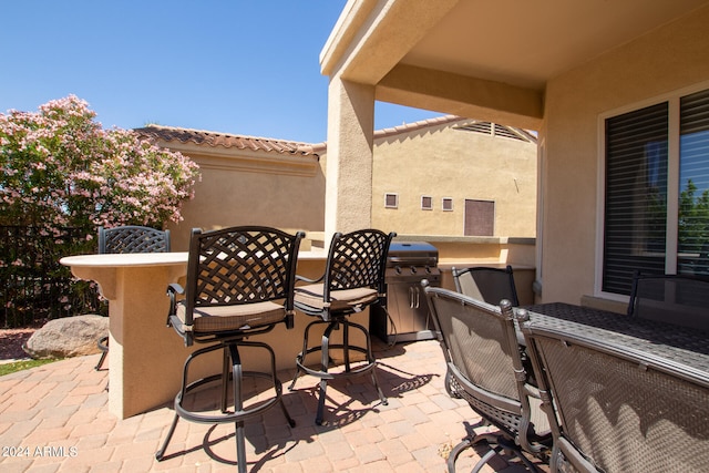 view of patio with a grill