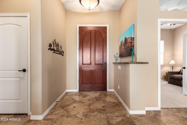 view of carpeted foyer