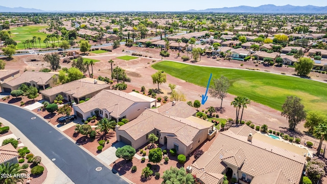 birds eye view of property featuring a mountain view