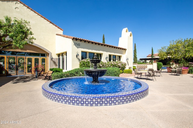 view of pool featuring a patio and french doors