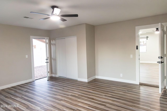 spare room with ceiling fan and hardwood / wood-style flooring