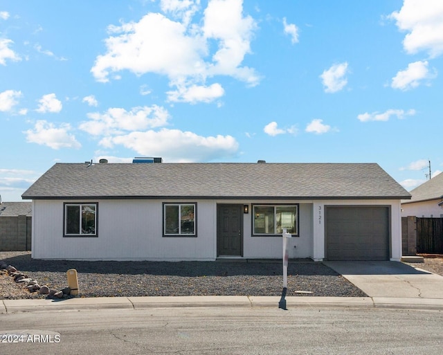 single story home featuring a garage