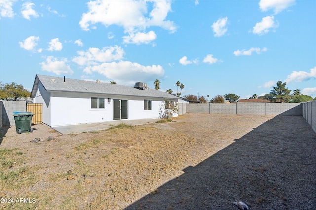 back of house with a patio