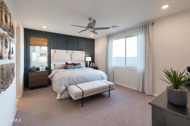 bedroom with ceiling fan and carpet