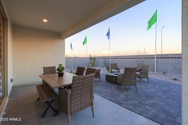 view of patio terrace at dusk