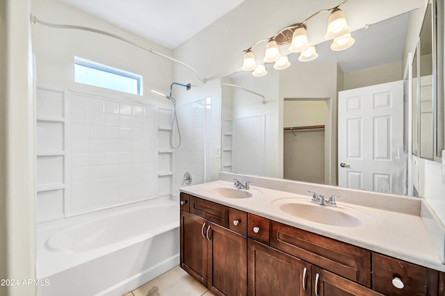 bathroom featuring  shower combination, tile patterned flooring, and double vanity