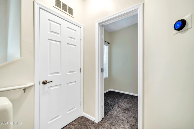 corridor featuring carpet flooring