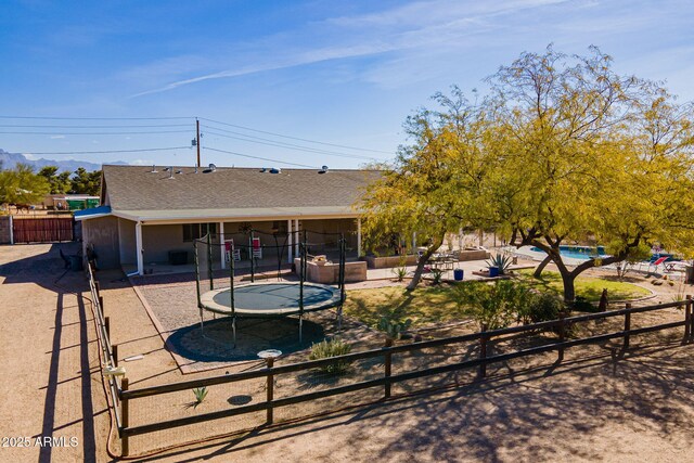 532 N 102nd Pl, Mesa, AZ 85207 - rear view of house with a trampoline, a patio, and roof with shingles