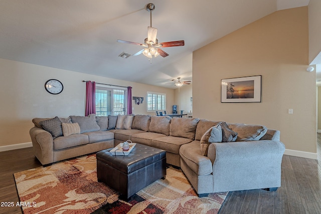 living room featuring hardwood / wood-style floors, vaulted ceiling, and ceiling fan