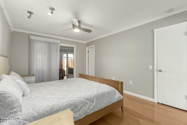 bedroom with ornamental molding, ceiling fan, baseboards, and wood finished floors