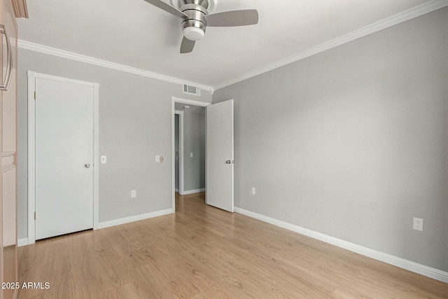 unfurnished bedroom with visible vents, baseboards, light wood-style flooring, ceiling fan, and crown molding