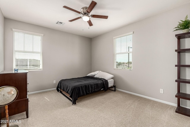 14727 W Pasadena Ave, Litchfield Park, AZ 85340 - bedroom featuring light colored carpet, baseboards, and a ceiling fan