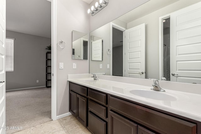 14727 W Pasadena Ave, Litchfield Park, AZ 85340 - full bath featuring double vanity, baseboards, and tile patterned floors