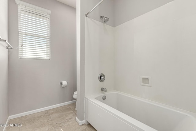 14727 W Pasadena Ave, Litchfield Park, AZ 85340 - bathroom with toilet, baseboards, and shower / bath combination