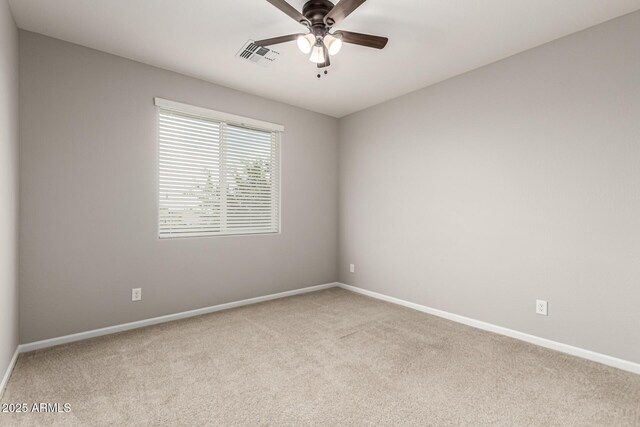 14727 W Pasadena Ave, Litchfield Park, AZ 85340 - spare room featuring carpet, a ceiling fan, and baseboards