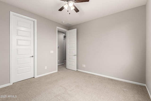 14727 W Pasadena Ave, Litchfield Park, AZ 85340 - unfurnished bedroom with carpet floors, baseboards, and a ceiling fan