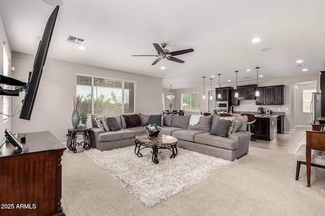 14727 W Pasadena Ave, Litchfield Park, AZ 85340 - living area featuring a ceiling fan, recessed lighting, light carpet, and baseboards