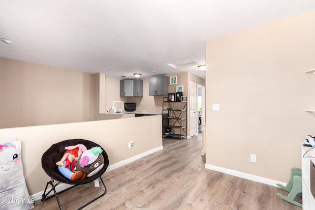 sitting room with light hardwood / wood-style flooring