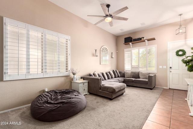 tiled living room featuring ceiling fan