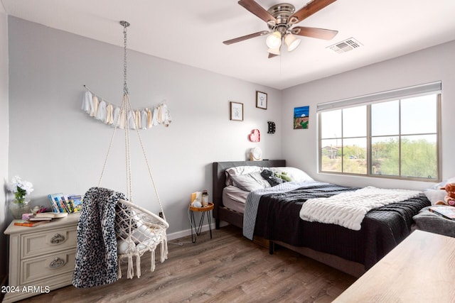 bedroom featuring ceiling fan and hardwood / wood-style flooring