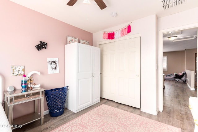 bedroom featuring a closet, ceiling fan, and light hardwood / wood-style floors