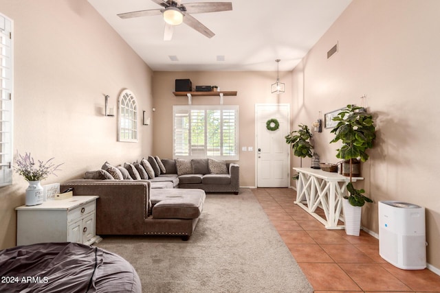 tiled living room featuring ceiling fan