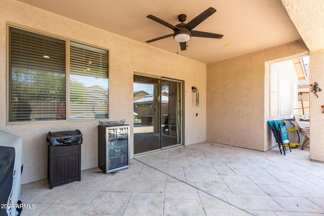 view of patio / terrace featuring ceiling fan and wine cooler