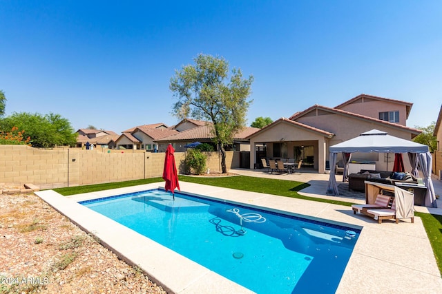 view of swimming pool with a gazebo, an outdoor living space, and a patio