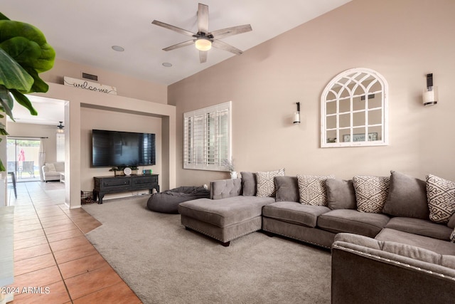 living room featuring tile patterned floors and ceiling fan