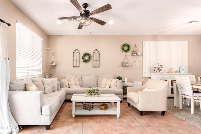 tiled living room featuring ceiling fan