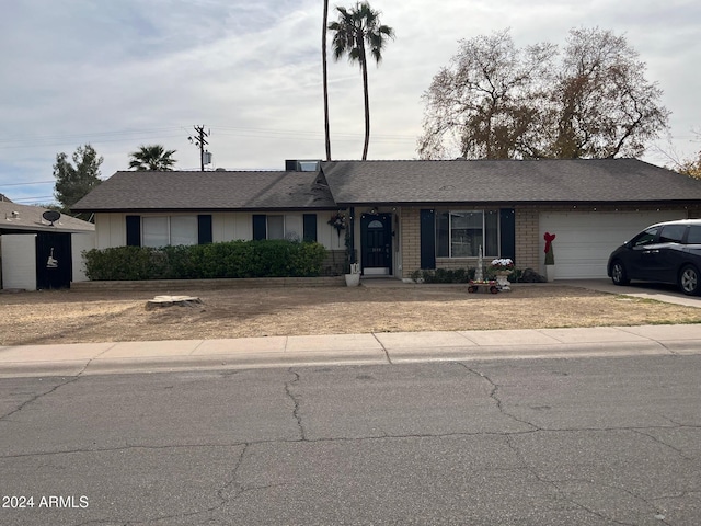 single story home featuring a garage