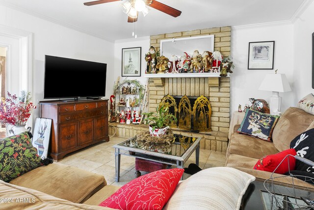 tiled living room featuring ornamental molding and a brick fireplace