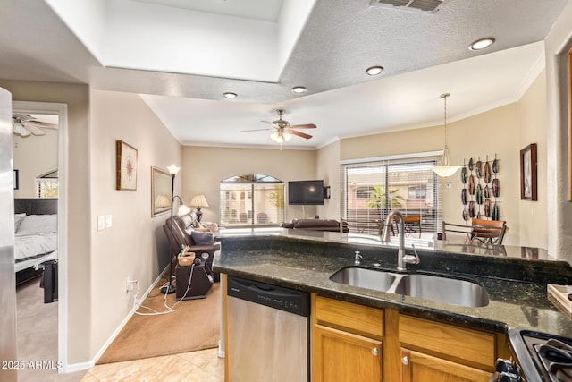 kitchen with a sink, ornamental molding, open floor plan, and dishwasher