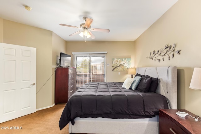 carpeted bedroom featuring a ceiling fan and baseboards