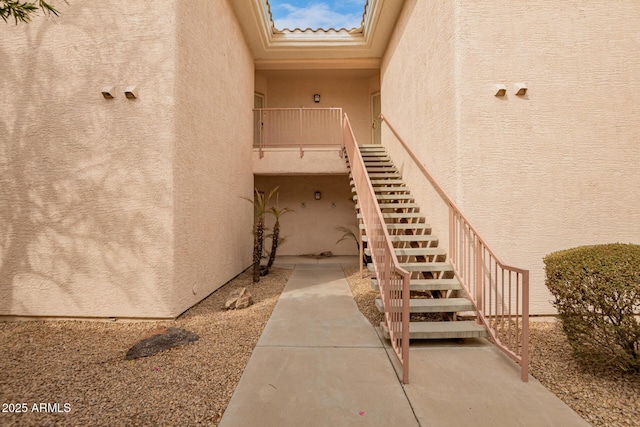 view of exterior entry featuring stucco siding