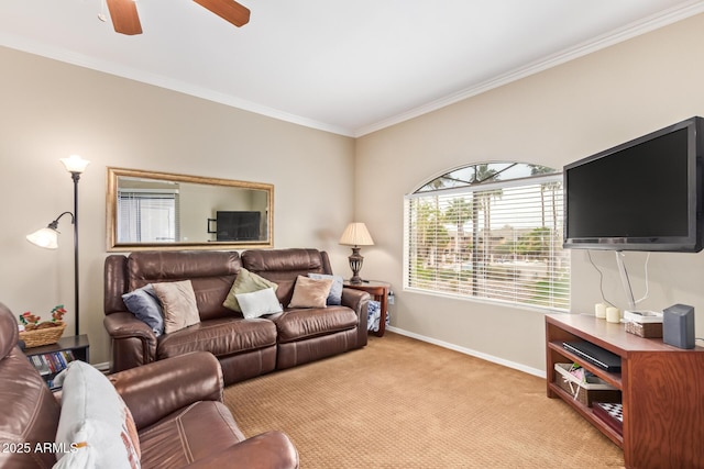 living room with baseboards, ornamental molding, a ceiling fan, and light colored carpet