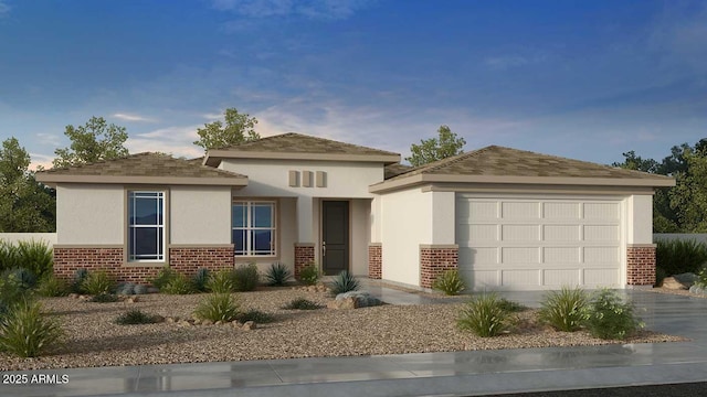 prairie-style home featuring a garage, brick siding, aphalt driveway, and stucco siding