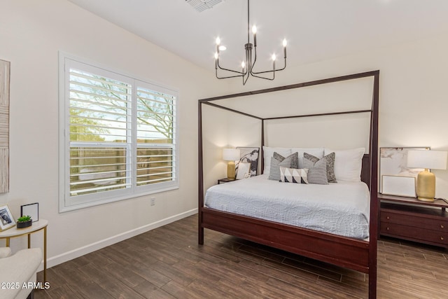 1951 W Plum Rd, Phoenix, AZ 85085 - bedroom featuring a chandelier, wood finished floors, and baseboards