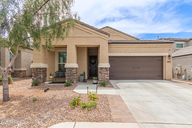1951 W Plum Rd, Phoenix, AZ 85085 - view of front facade with stucco siding, an attached garage, driveway, and stone siding