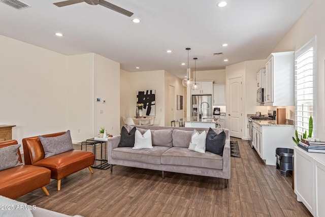 1951 W Plum Rd, Phoenix, AZ 85085 - living area with plenty of natural light, dark wood-style flooring, a ceiling fan, and recessed lighting