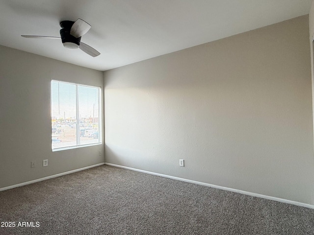 3840 N 43rd Ave Unit 34, Phoenix, AZ 85031 - unfurnished room with carpet flooring, a ceiling fan, and baseboards